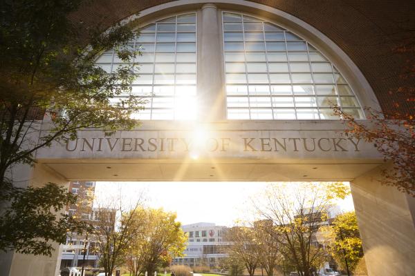 Photo of University of Kentucky sign with sun shining behind it