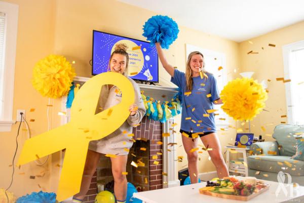 Photo of two students celebrating DanceBlue at home