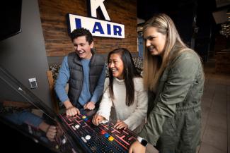 Students playing video game at K Lair