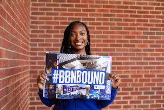 Student with BBNBound Sign