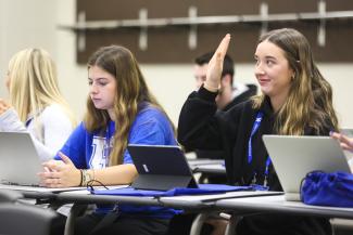 Student with hand raised