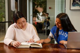 two students reading and studying