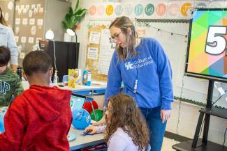 Education student working with elementary school students