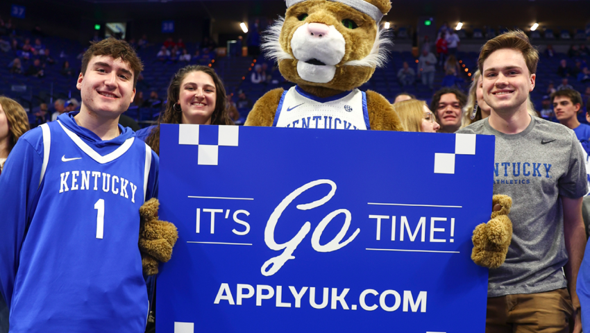Wildcat and students with sign that says it's go time applyuk.com