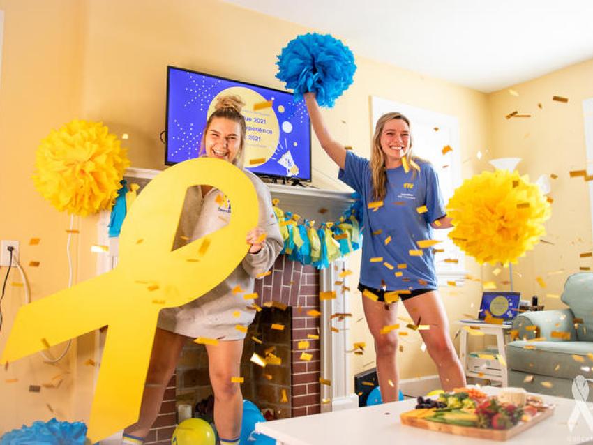 Photo of two students celebrating DanceBlue at home