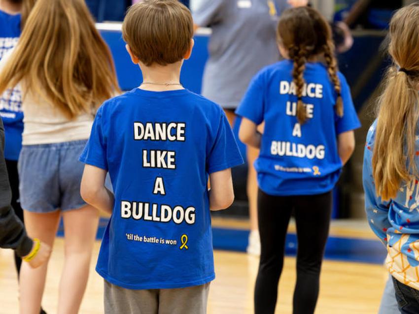 students in gymnasium dancing