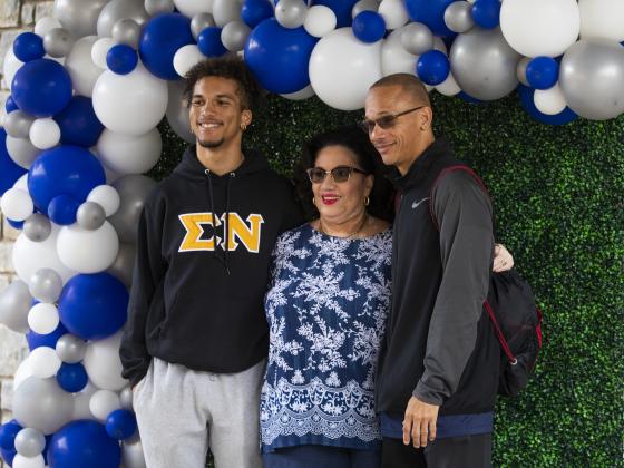 Student and parents at Family Weekend